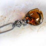 Top of Amber & sterling silver custom wire wrapped setting