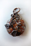  brown, orange and grey, smooth, handmade wire pendant