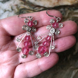 Hand holding Pink Ice Sterling Silver Wire Wrapped Dangle Earrings - Handmade Swarovski Crystal Drop Earrings