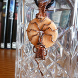Hanging peach gemstone donut wire wrapped copper wire