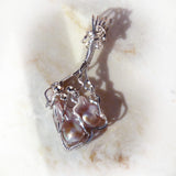 One of a kind sterling silver wire wrapped blister pearls.