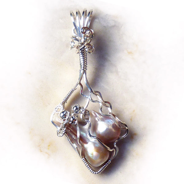 Wire wrapped blister pearls in sterling silver. Handmade.