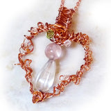 front of wire wrapped copper & flourite  angel pendant