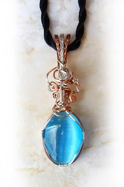 light sky blue cats eye wire wrapped pendant necklace