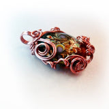 Floral lampworked glass w swirl copper wire wrap pendant