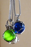 Handmade silver wire wrapped blue glass marble pendant