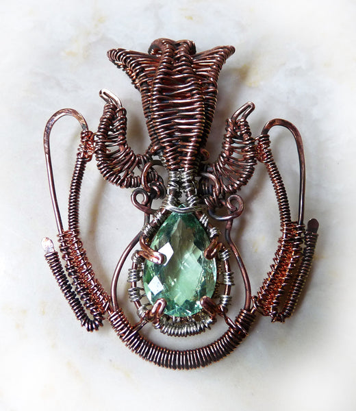 Faceted green fluorite, silver and copper wire wrap pendant.