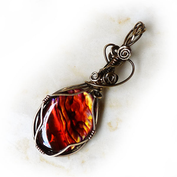 Bronze wire wrap with orange paua shell by Rhonda Chase