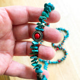 Hand holding Genuine Turquoise, Green and Red, Beautiful Beaded Necklace 