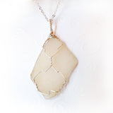 handmade wire wrapped natural sea glass in sterling silver