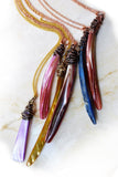Colorful mother of pearl talon pendants with wire wrapping.
