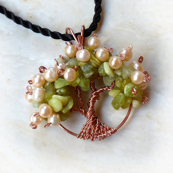 Pearl wire wrapped tree pendant. Green, copper, peach.