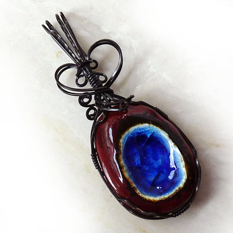Porcelain blue and rust wire wrap pendant